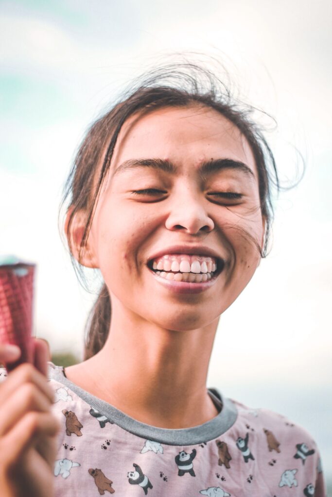 Confident woman smiling portrait showcasing health and confidence
