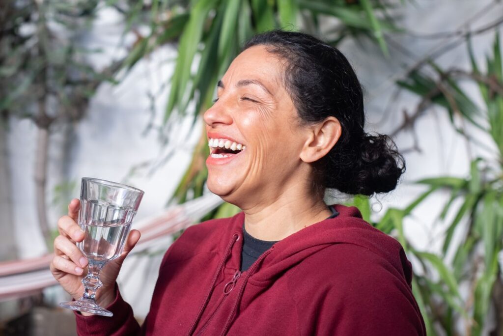 Happy woman enjoying life outdoors feeling healthy and energetic